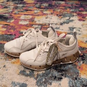 Reebok White and Gold Sleek Sneakers